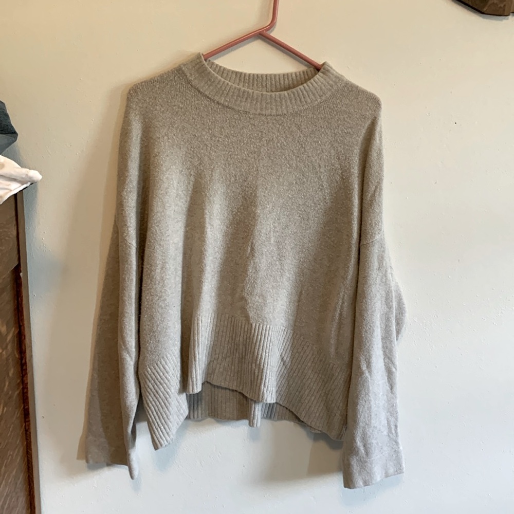 Light gray sweater. Good quality. No rips, holes, or stains.